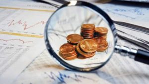 top penny stocks to watch this week magnifying glass pennies
